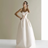 A magnificent wedding dress of a tight cut