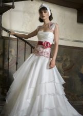 Wedding dress with a red bow