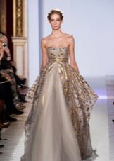 A puffy evening dress with gold trim