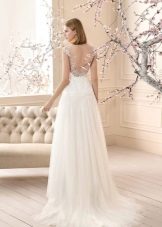 A wedding dress with a neckline and a-line train