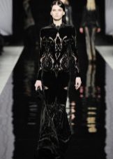 Black velvet dress with long sleeves on the floor