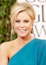 Blonde in a turquoise dress and makeup under it