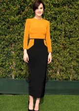 Black shoes under a black mustard dress