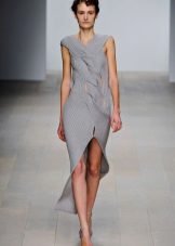 Knitted dress with braids with a slit