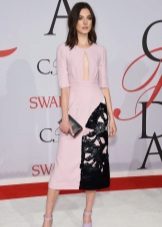 Pink dress with a black clutch