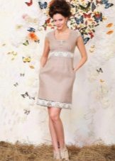 Linen dress with lace at the waist and hem of the skirt