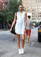 Denim shirt dress with sneakers and a bulk bag