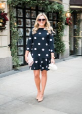 Black dress in a straight cut in white polka dots