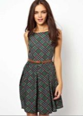 Short green plaid dress with a thin red leather strap