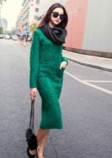 Knitted angry dress of medium length with a long sleeve