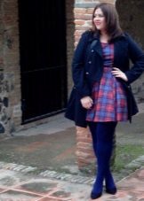 A dress in a blue and red plaid for overweight women in combination with blue tights and a blue coat