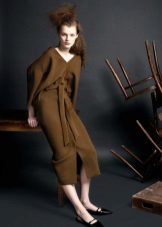 Dress with a cut sleeve