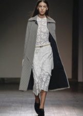 The fitted dress is lace white