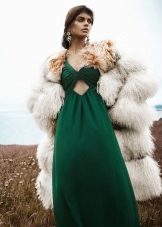Short fur coat to a long green dress
