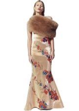 Fur cape to a beige sheath dress