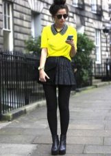 Black sun skirt and bright sweatshirt