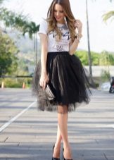 A multi-layered black skirt combined with a t-shirt