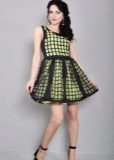 Light green dress with a black perforated layer