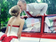 Wedding dress with a red bow and a car
