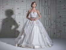A magnificent wedding dress with transparent sleeves