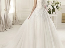 Lush wedding dress with voluminous flowers