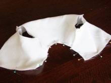 Stitching bodice of baptismal dress