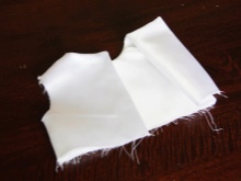 Stitching the lining and bodice of the baptismal dress