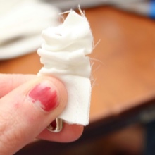 Twisting the stitched strip with a pin