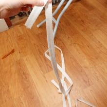 Sewing ribbons on a wedding corset