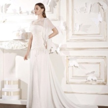 A wedding dress with a train and a deep neckline