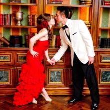 The image of the bride and groom in a red wedding