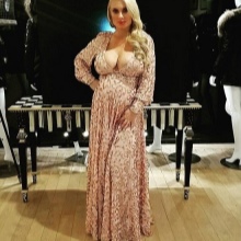 Beige maternity long dress with a deep neckline and a long sleeve for pregnant women