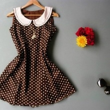 Short brown dress in white polka dots with a white collar