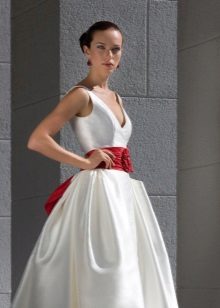 A puffy wedding dress with a ribbon decorated with a bow