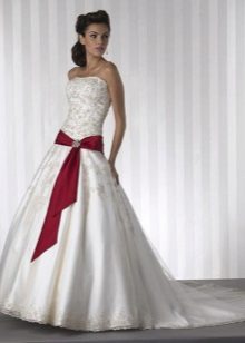 Wedding dress with red ribbon on the hips