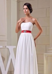 Wedding dress with a wide red belt and jewelry