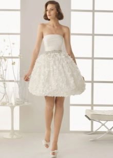 Short and puffy wedding dress with ruffles on the skirt