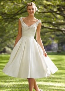 A wedding dress with a full and tight skirt