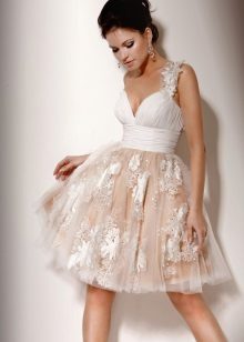 Short wedding dress with a full skirt and a floral pattern