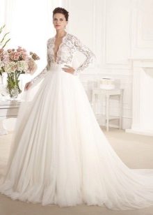 Openwork wedding dress with a low neck