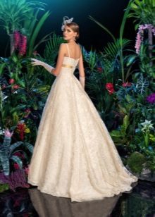 A puffy lace wedding dress with a train