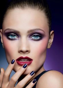 Makeup with purple eyeshadow and red lipstick.