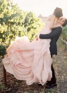 Pale pink wedding dress of the bride