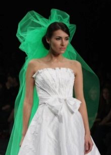 White wedding dress with a green veil