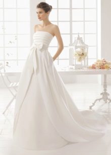 A-line wedding dress with a train and bow