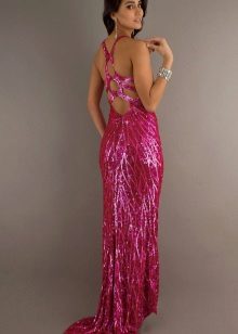 Long dress in fuchsia color with an unusual cut of sequins