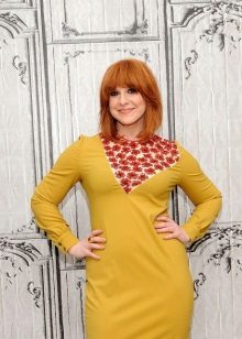 Red-haired girl in mustard dress