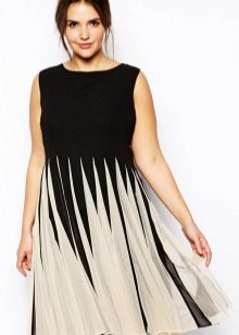 Dress with a pleated skirt of medium length concealing protruding belly