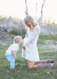 White dress for a pregnant photo shoot - son kisses tummy