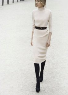 White office dress with a black belt, black tights and shoes